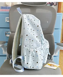 Cute star print school backpack with large capacity and side pockets for students daily use.