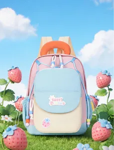Close-up detail of the cute color-blocking kids backpack with strawberry patch and sweet text.