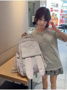 Adorable sac à dos japonais rose à motif d'étoiles avec oreilles de lapin mignonnes.
