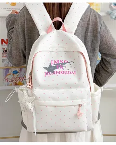 Japanese style cute polka dot school backpack with star print and spacious capacity for students.