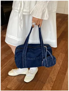 Vintage washed denim women commuting tote shoulder bag with mini pouch detail view
