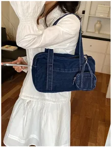 Vintage washed denim tote bag for women, casual shoulder bag with coin purse detail.