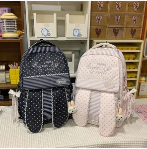 Joli sac à dos Harajuku avec oreilles de lapin, motifs d'étoiles et beaux nœuds pour l'école.