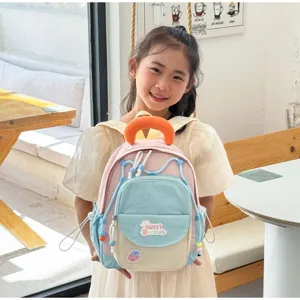 Cute colorblock kids backpack for kindergarten, stylish casual school bag for young girls.