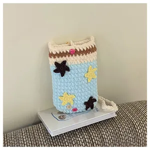 Handmade crochet star pattern phone bag, cute blue cross-body knit bag for daily commute.