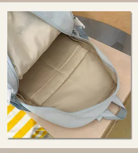 Detailed view of the large capacity light blue school backpack interior structure and lining.