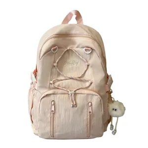 Pink Japanese style minimalist drawstring large capacity school backpack with cute fluffy keychain.