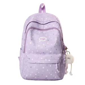 Sac à dos violet avec motif étoiles multi-compartiments pour étudiants vue de détail