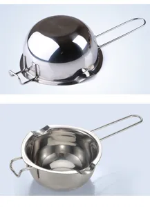 Stainless steel melting pot for butter and chocolate with dual pour spouts and handle.