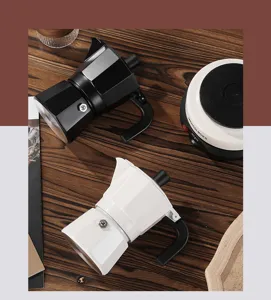 Detail view of Italian double valve moka pot, classic espresso maker for home coffee brewing.