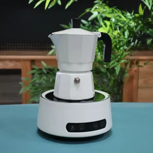 White double valve moka pot with electric heating base for espresso kitchen detail