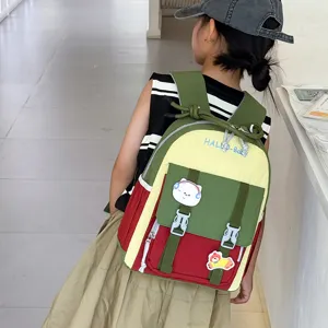 Cute colorblock kids schoolbag preschool backpack with adorable cartoon patches for daily use.