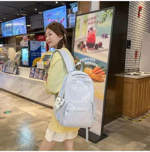 Sac à dos d'école à pois mignon pour femmes, grand sac de voyage élégant de style collège.