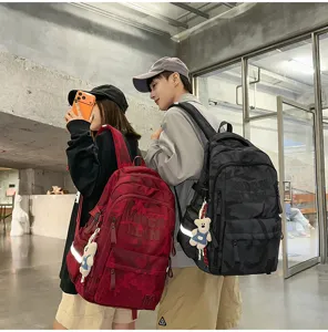 Detail view of stylish camouflage double shoulder backpack with multi compartments and large capacity.