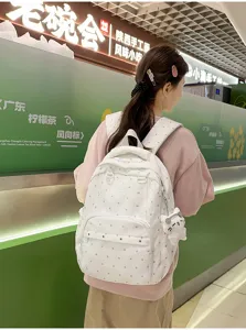 Sac à dos à pois élégant avec pendentif chat, cartable décontracté pour les voyages et l'école.
