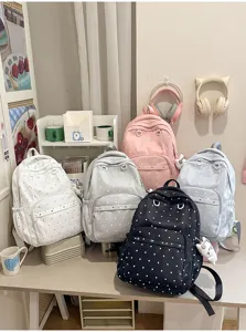 Joli sac à dos scolaire à pois avec une grande capacité pour les étudiants au quotidien.