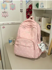 Sac à dos rose à pois mignon pour l'école et le quotidien avec pendentif, élégant.