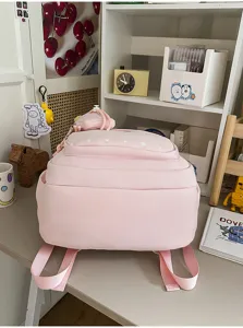 Aesthetic pink school backpack with star print, large capacity multi-compartment design.