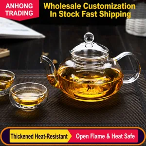 Clear heat resistant borosilicate glass teapot with infuser for brewing loose leaf tea securely.