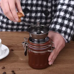 Portable manual coffee grinder featuring ceramic mechanism and stainless steel crank handle