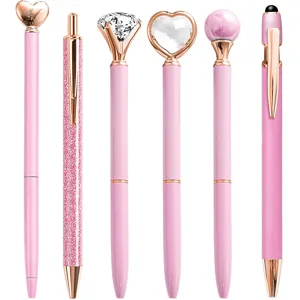 Set of six stylish pink and rose gold decorative ballpoint pens with crystal toppers.