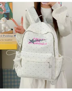 Japanese style polka dot school backpack with star print and large capacity for students.