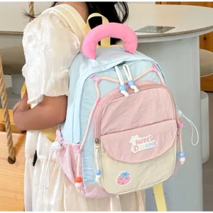Cute color-block kids backpack with sweet dreams patch, stylish school bag for girls.