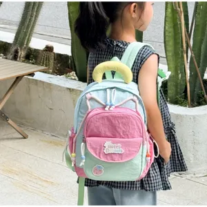 Cute pastel color-block kids backpack detail view, featuring sweet design and comfortable straps.