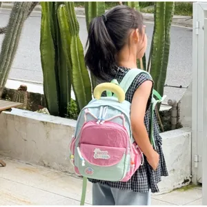 Cute color-block children backpack for kindergarten girls with cute design and sweet dreams patch.