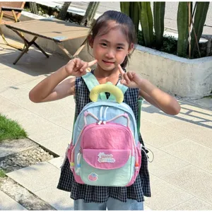 Cute colorful kids backpack for kindergarten girls with sweet dreams patch and contrast color design.
