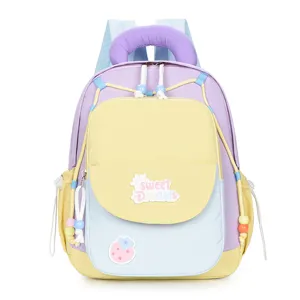 Cute color block kids backpack detail shot featuring sweet dreams patch and vibrant pastel tones.
