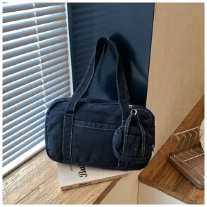 Black washed denim shoulder bag with white contrast stitching, casual underarm tote for women.