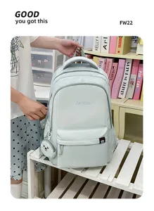 Zaino scolastico in nylon color caramella per studenti, grande zaino casual con grazioso ciondolo.