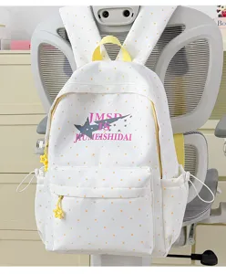 Detailed view of the Japanese style polka dot backpack, featuring cute star print and front pocket.