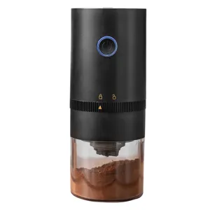 Detail view of the portable electric coffee bean grinder with clear container and USB charge.
