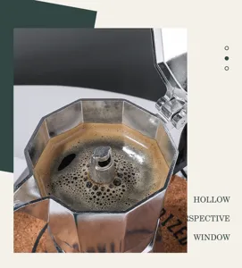 Close-up detail of aluminum octagonal moka pot interior, brewing fresh coffee on cork mat.