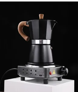 Household mini electric stove with classic black moka pot for coffee tea heating compact design.