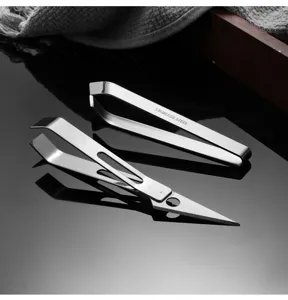 Detailed view of stainless steel hair plucking tweezers and precision scissors for kitchen use.