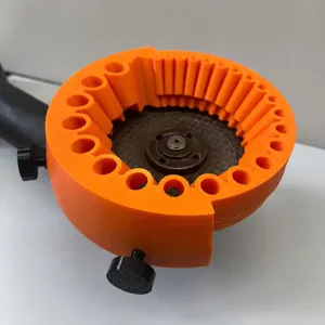 Drill bit sharpener detail accessory, 3D printed orange plastic jig with multiple holes.