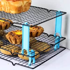 Wire cooling rack stackers for baking, multi-tier metal wire cooling trays with blue supports.
