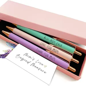 Close-up of metal ballpoint pens gift box set with mom quotes and pink packaging box.