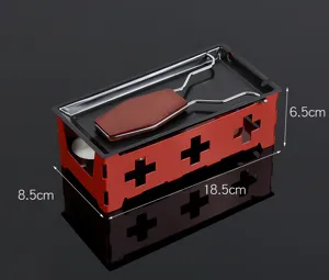 Mini cheese raclette grill detail view with red cross hollow stand and candle holder.