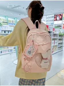 Süßer rosa College-Rucksack mit transparentem Herzfenster und niedlichem Plüschtier für Schüler.