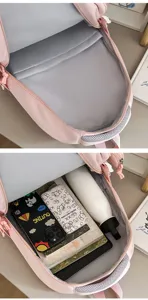 Detailed view of pink school backpack interior compartments showing large capacity and organization.