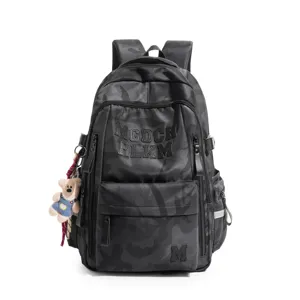 Detailed view of the black camo backpack, multi-compartment large capacity school bag.