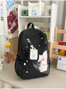 Schwarzer Studentenrucksack mit transparentem Sichtfenster und Plueschpuppe fuer den Schultag.