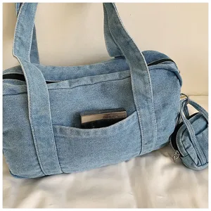 Detailed view of casual vintage washed denim women shoulder boston bag with coin pouch.