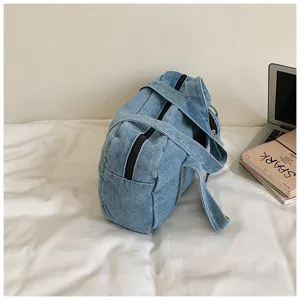 Detailed view of casual vintage washed denim shoulder bag, soft texture and sturdy straps.