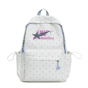 White polka dot canvas backpack for school students with large capacity and front pocket design.