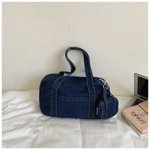 Vintage washed denim tote bag for women, casual shoulder bag with small pouch for daily commute.